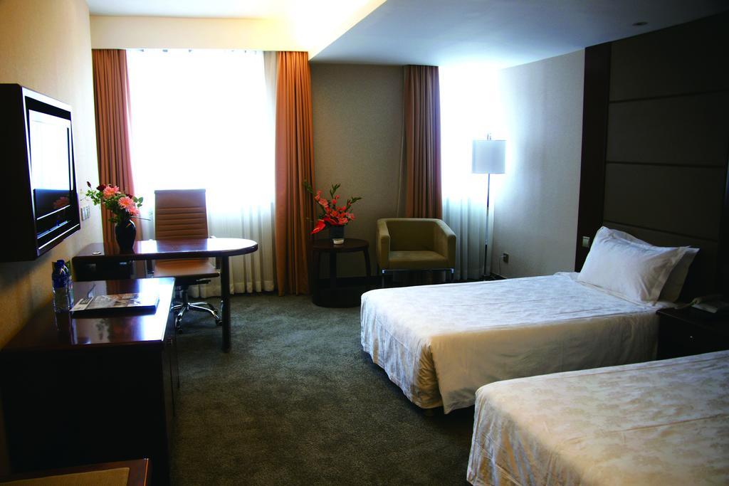 New Gloria Plaza Garden Hotel Harbin Quarto foto