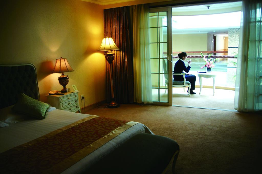 New Gloria Plaza Garden Hotel Harbin Quarto foto