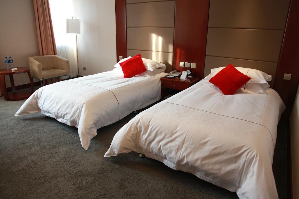 New Gloria Plaza Garden Hotel Harbin Quarto foto